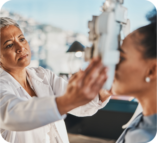 Image of doctor checking a patient's eyes