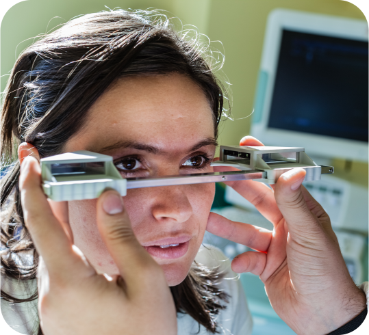 Image of patient being checked with eye instrument